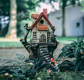 Model house in a garden. Links to Gifts of Real Estate Model house in a garden. Links to Gifts of Real Estate