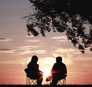 Two people sitting outside. Links to Gifts from Retirement Plans Two people sitting outside. Links to Gifts from Retirement Plans